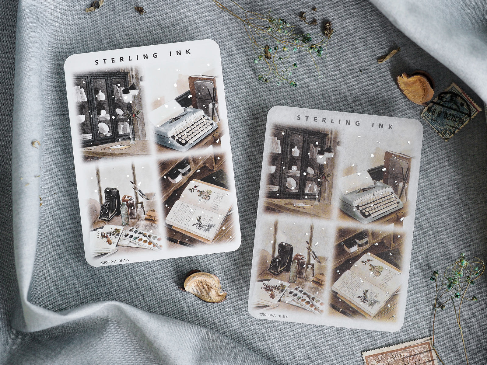 Illustration stickers set with silver foil accents, displaying a moody, autumnal desk scene filled with old books, vintage writing instruments, and stacked ink bottles.