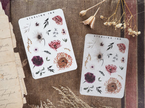 Sticker sheets featuring autumnal botanical illustrations of detailed flowers, leaves, and rustic natural elements.