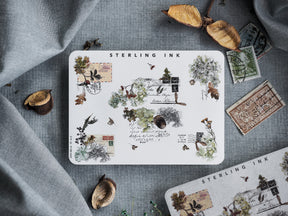 Autumnal "Edges and Corners Stickers (Silver Foil) - October 2023," featuring a cluster of vintage stamps, delicate leaves, and rustic decorative illustrations on white paper.