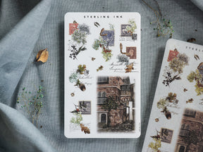 A dense arrangement of vintage sticker sheets featuring sepia-toned engravings of European architecture, botanical illustrations, and antique scientific sketches.