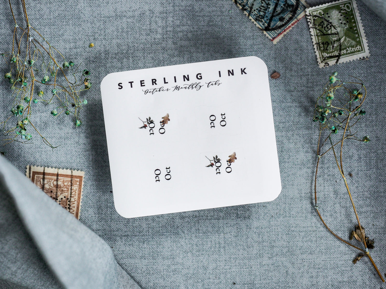 White monthly planner tabs for October 2023 by Sterling Ink, featuring multiple labeled sections and charming decorative owl graphics for organization.