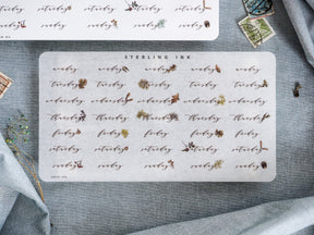 Beige weekly planner stickers featuring the days of the week and organized date fields for October 2023 scheduling and journaling.
