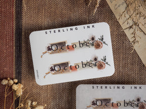 Rustic October sticker labels featuring dried autumn foliage, delicate brown floral sprigs, and seasonal text for crafting or journaling.