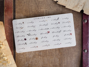 Rustic planner stickers featuring individual weekdays stamped in rich sepia brown ink, perfect for journaling and decorating a daily calendar spread.