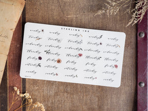 Decorative grid of weekly stickers featuring days of the week, printed in varying deep brown and maroon ink, perfect for October 2024 planning and bullet journaling.