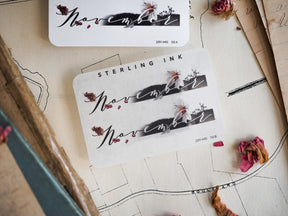 Black and gray ink sticker set for November, featuring elegant scripted calligraphy and delicate pressed floral illustrations suitable for journaling and planning.