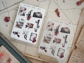 Decorative sticker sheets featuring autumnal icon sets, including dried botanicals, rustic teacups, and seasonal elements highlighted with silver foil accents.