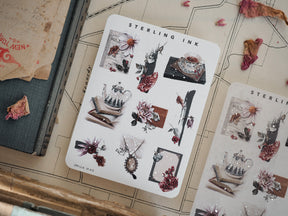 Detailed sticker sheets featuring vintage scientific sketches, pressed botanicals, and delicate floral illustrations from a "Sterling Ink" themed collection.