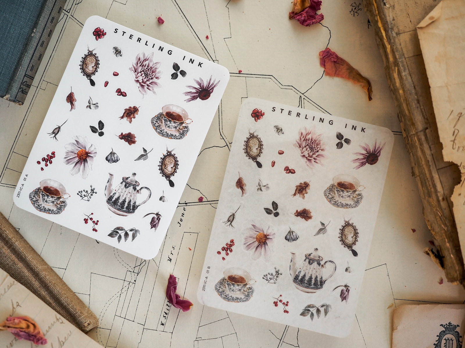 Two vintage botanical sticker sheets featuring diverse elements like small teapots, flowers, berries, and leaves in detailed, muted earth tones.