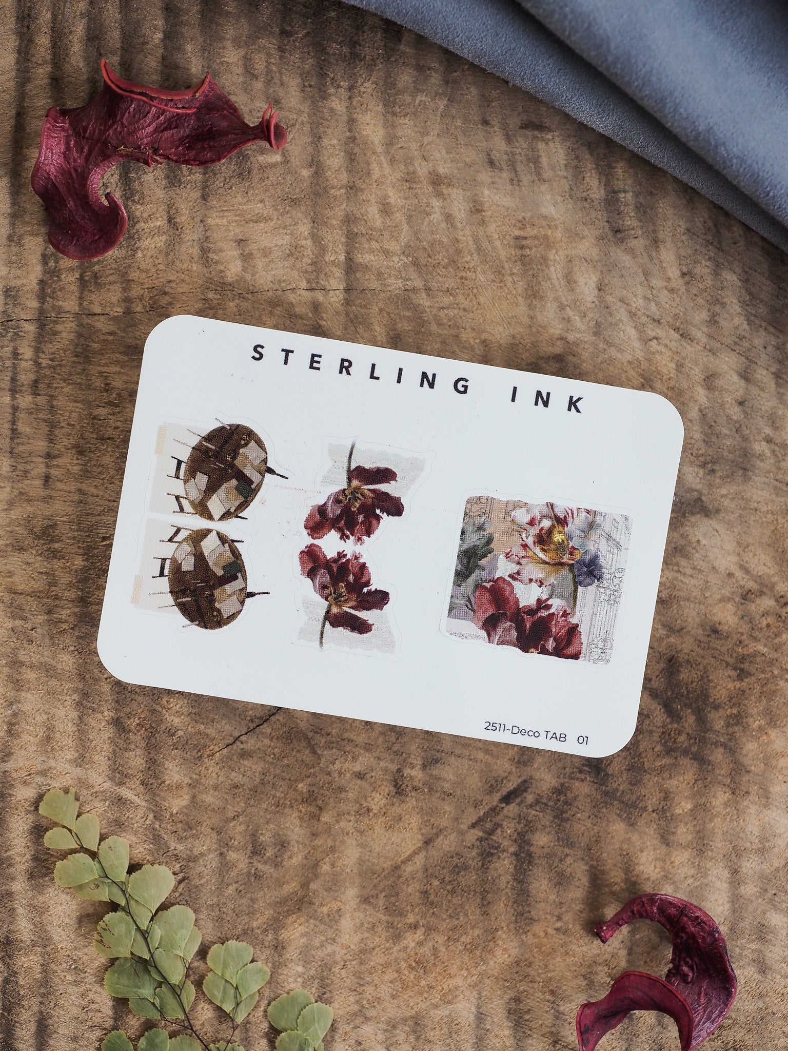 A card featuring three decorative autumn tabs with rich botanical sketches, deep red florals, and rustic fall leaf designs for journaling.
