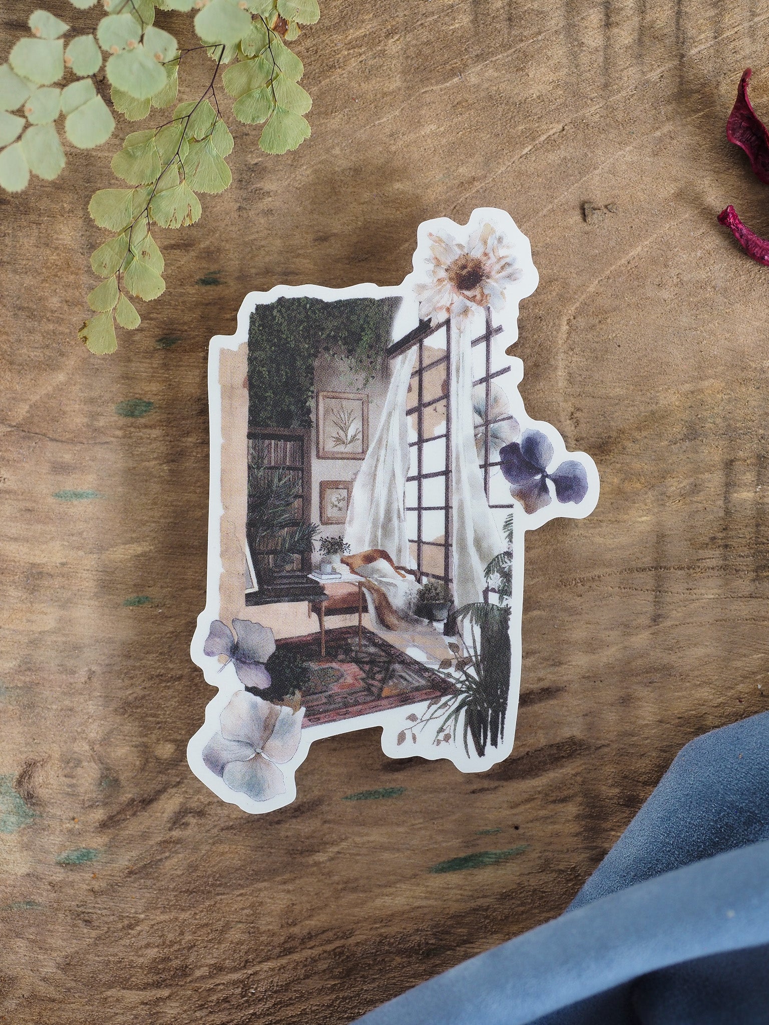 Detailed "Book Lounge" sticker illustration featuring a cozy reading nook, complete with bookshelves, comfy chairs, and soft floral accents.