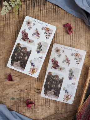 Decorative sticker sheet displaying vintage architectural vignettes and elegant bouquets of muted fall-toned flowers and rich foliage.