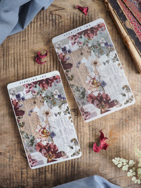 Vintage sticker strips featuring a delicate blend of botanical bouquets and detailed architectural sketches in muted burgundy, blush, and cream tones.