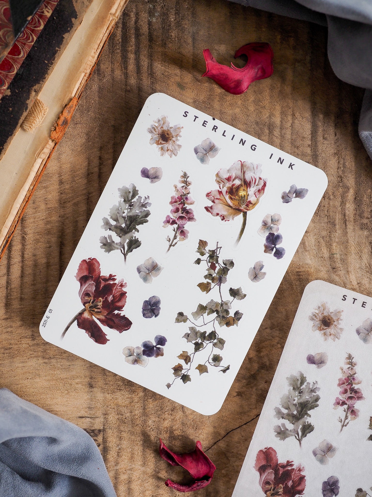 A collection of botanical elements stickers featuring soft mauve, dusty purple, and rich tones of foliage and dried floral arrangements.