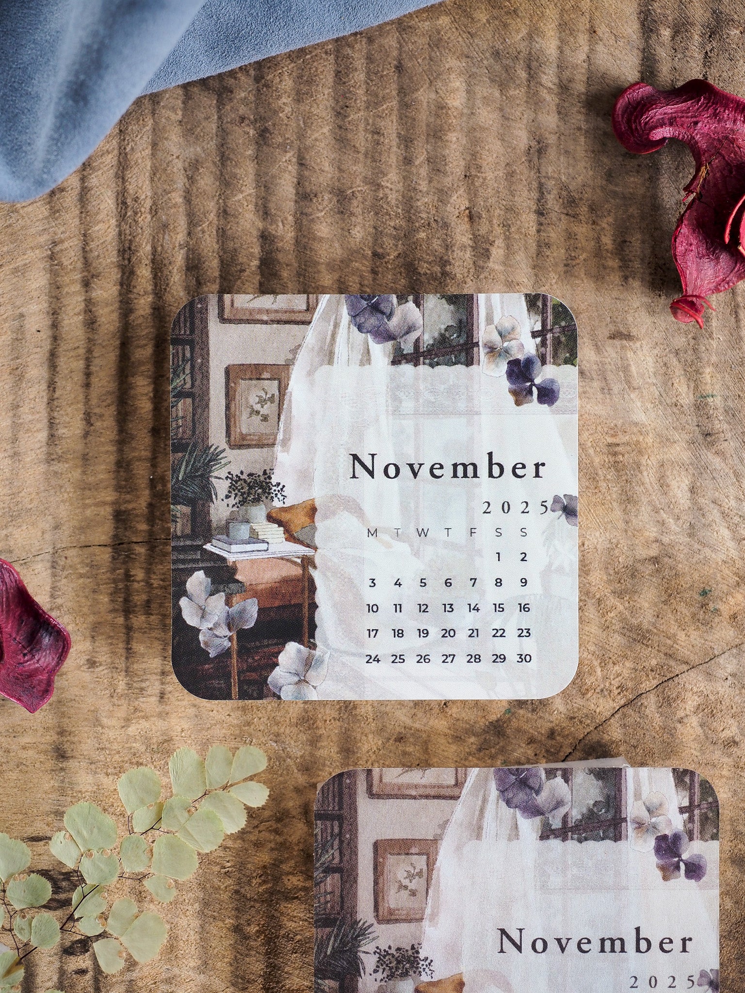 Vintage November 2025 calendar insert with a rustic, decorative design featuring soft purple florals and muted antique paneling.