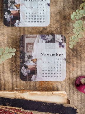 Decorative November 2025 monthly calendar featuring a soft, vintage aesthetic with muted tones, elegant floral accents, and a functional date grid.