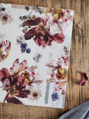 Rich watercolor floral pattern of burgundy and cream roses, accented with dusty blue filler flowers, labeled 'Vellum - November 2025'.