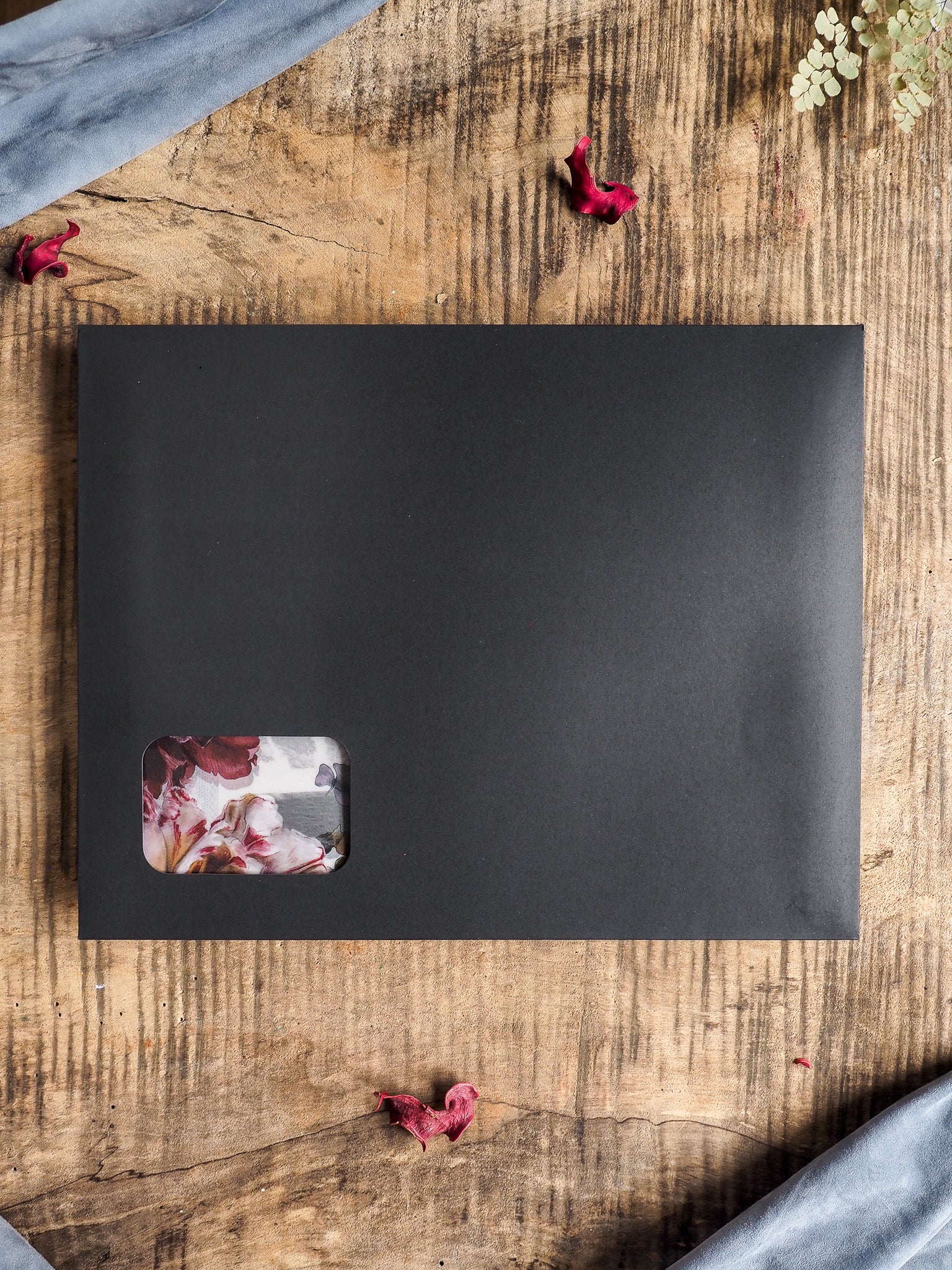 Dark gray planner or kit cover featuring a rectangular window revealing delicate pink and white floral designs, perfect for November 2025 seasonal planning.