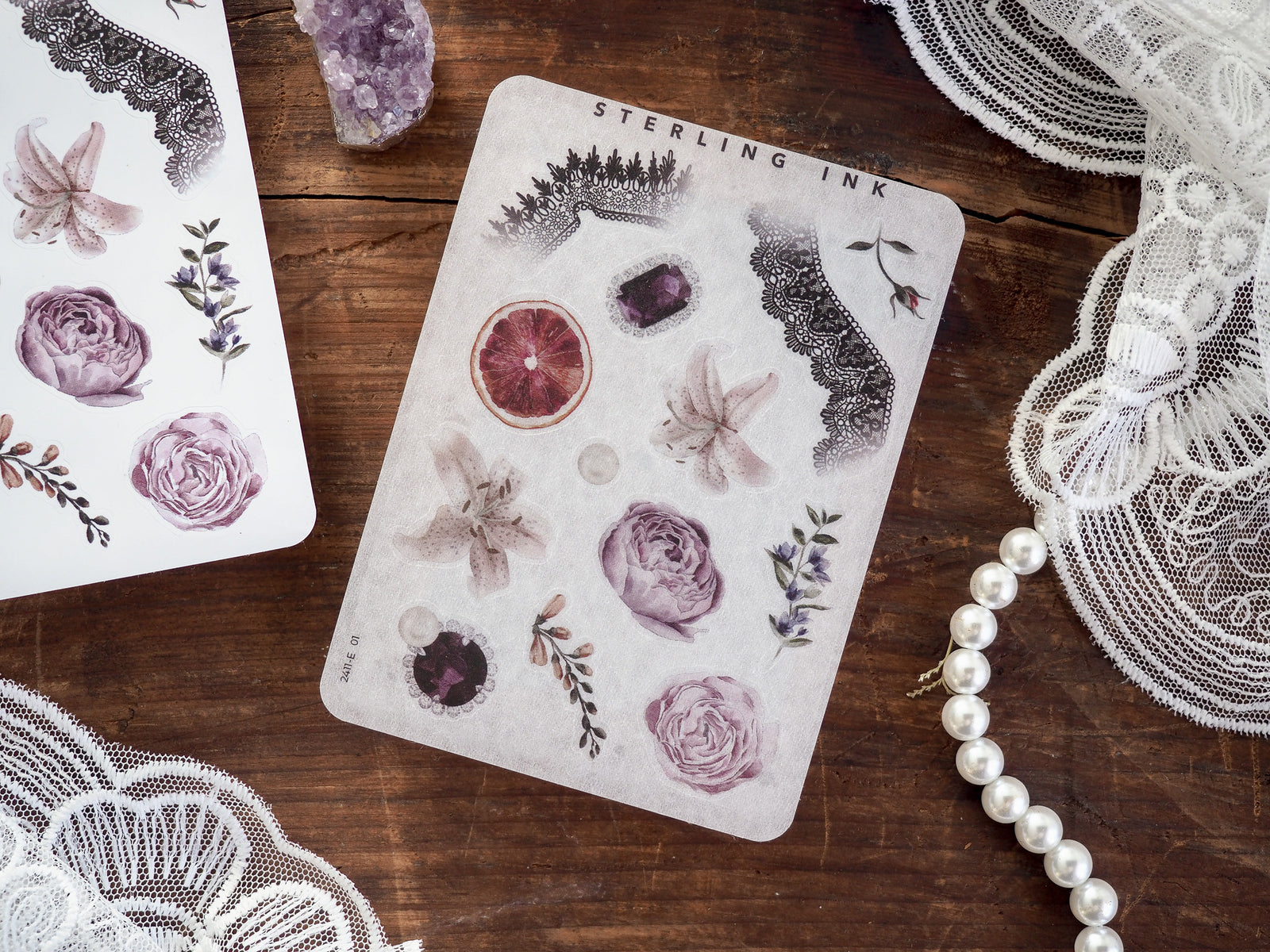 Elegant sticker sheet for November, featuring pale botanical elements like detailed roses, lavender, and citrus slices for crafting and journaling.