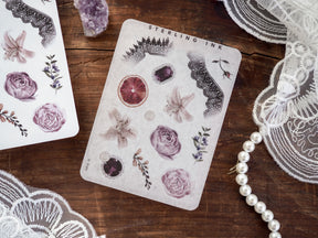 Elegant sticker sheet for November, featuring pale botanical elements like detailed roses, lavender, and citrus slices for crafting and journaling.