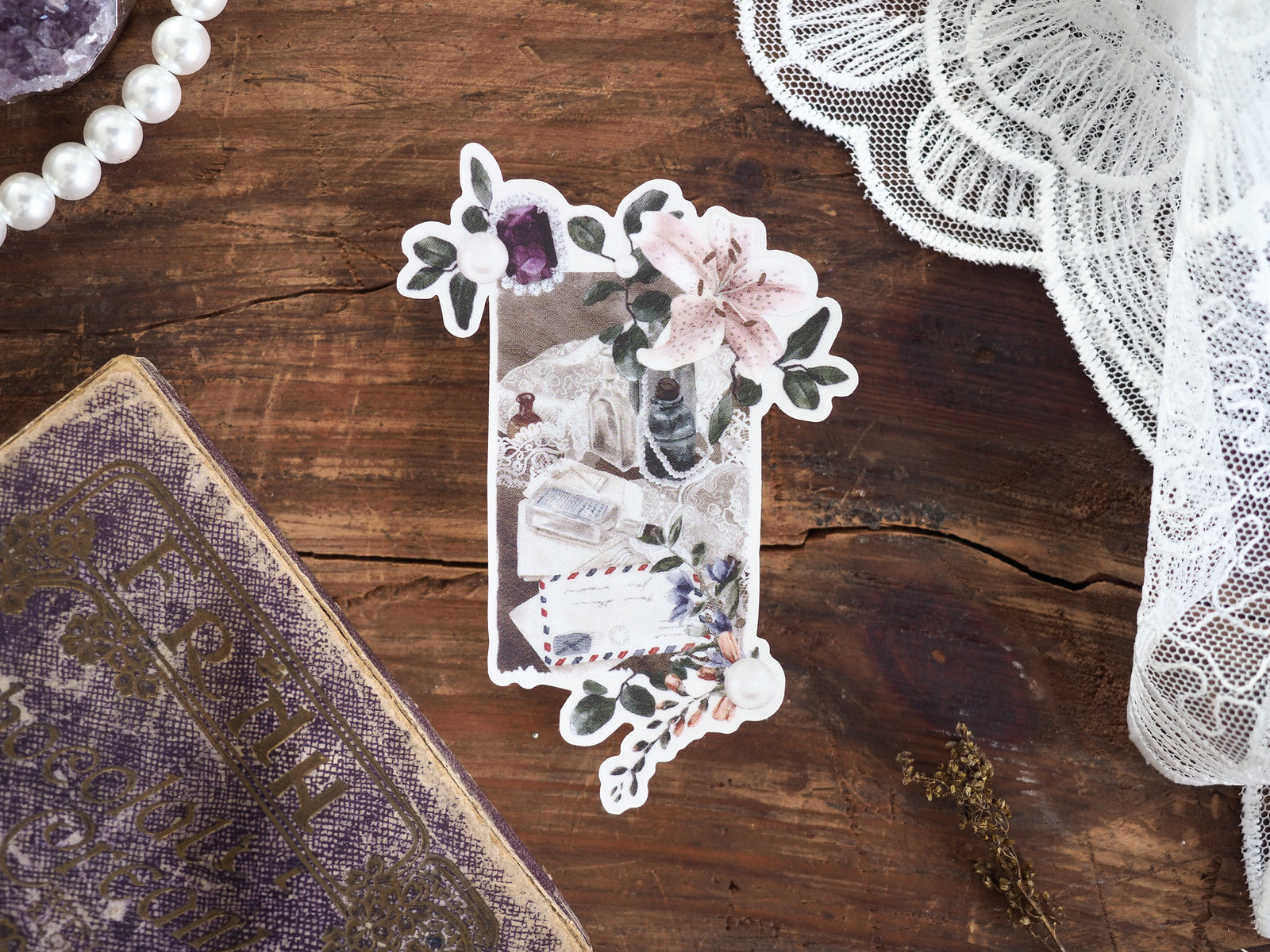 Seasonal floral die-cut sticker featuring a delicate pastel bouquet of roses, greenery, and deep tones, printed on clear vinyl for crafting use.