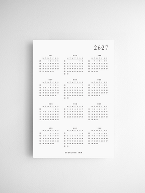 Minimalist A5 desk calendar cards for 2026-2027, featuring a clean black and white grid design for organizing monthly dates and daily planning.