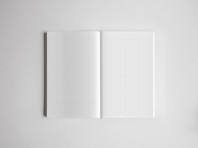 Open, minimalist A5 grid notebook showing light graph paper lines across crisp white pages, perfect for detailed planning, drafting, or note-taking.