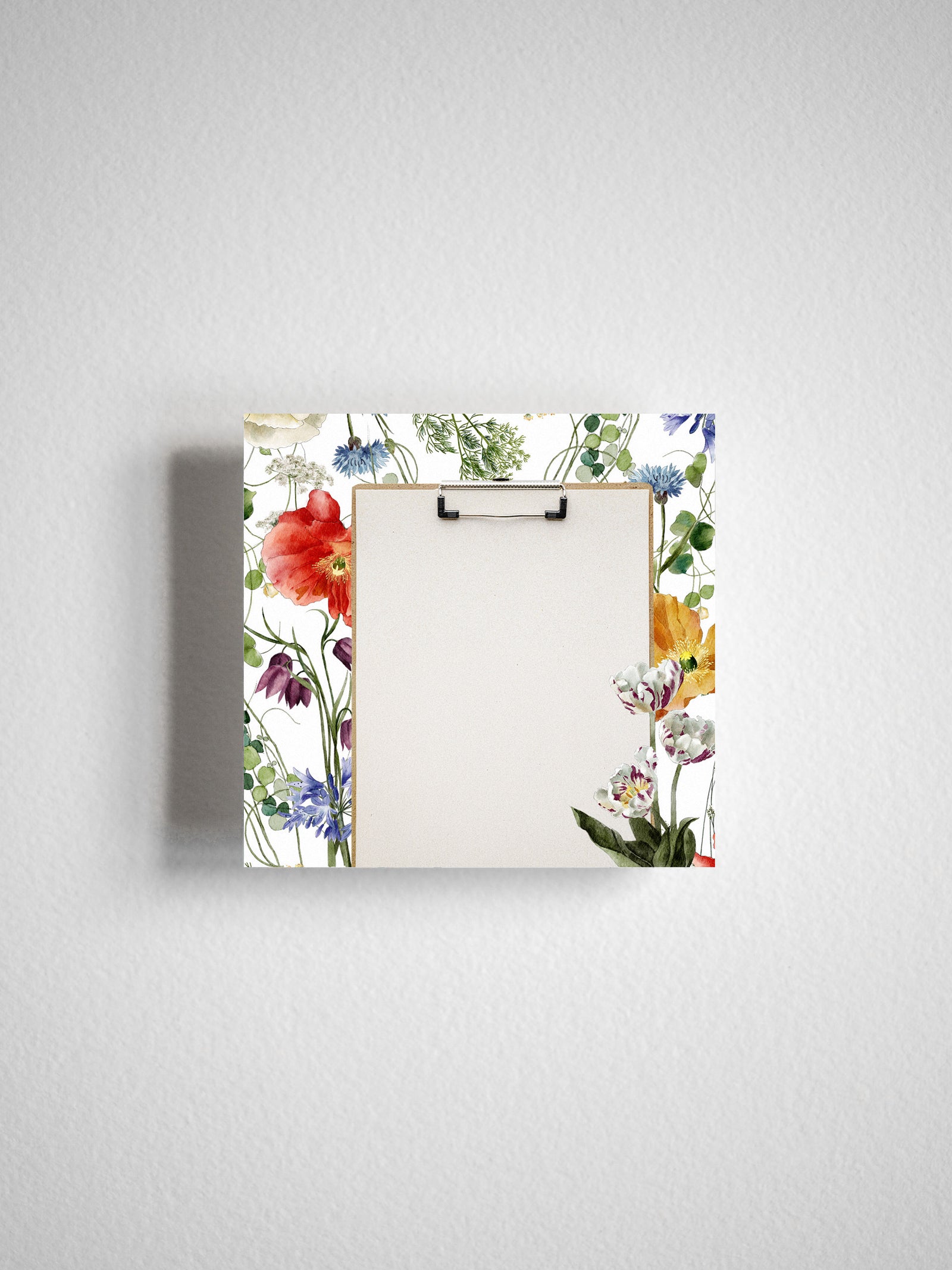Vibrant watercolor corner adhesive note with a white center, framed by a lush border of assorted spring flowers including red poppies and blue blossoms.