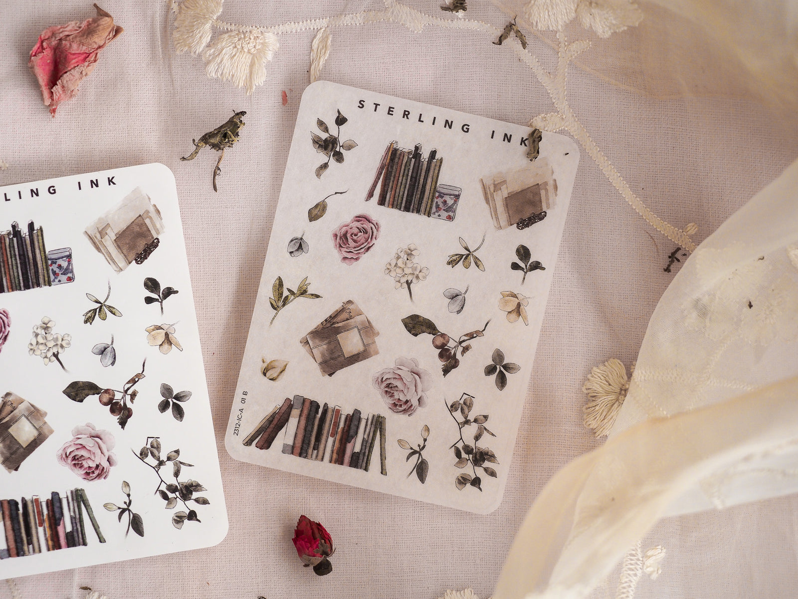 Vintage sticker sheets featuring miniature botanical elements, including dried leaves, muted floral clusters, and rustic architectural components for journaling and scrapbooking.