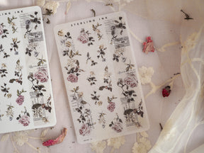 Vintage botanical washi strip stickers featuring detailed illustrations of pink roses, green leaves, and delicate berries on white paper.
