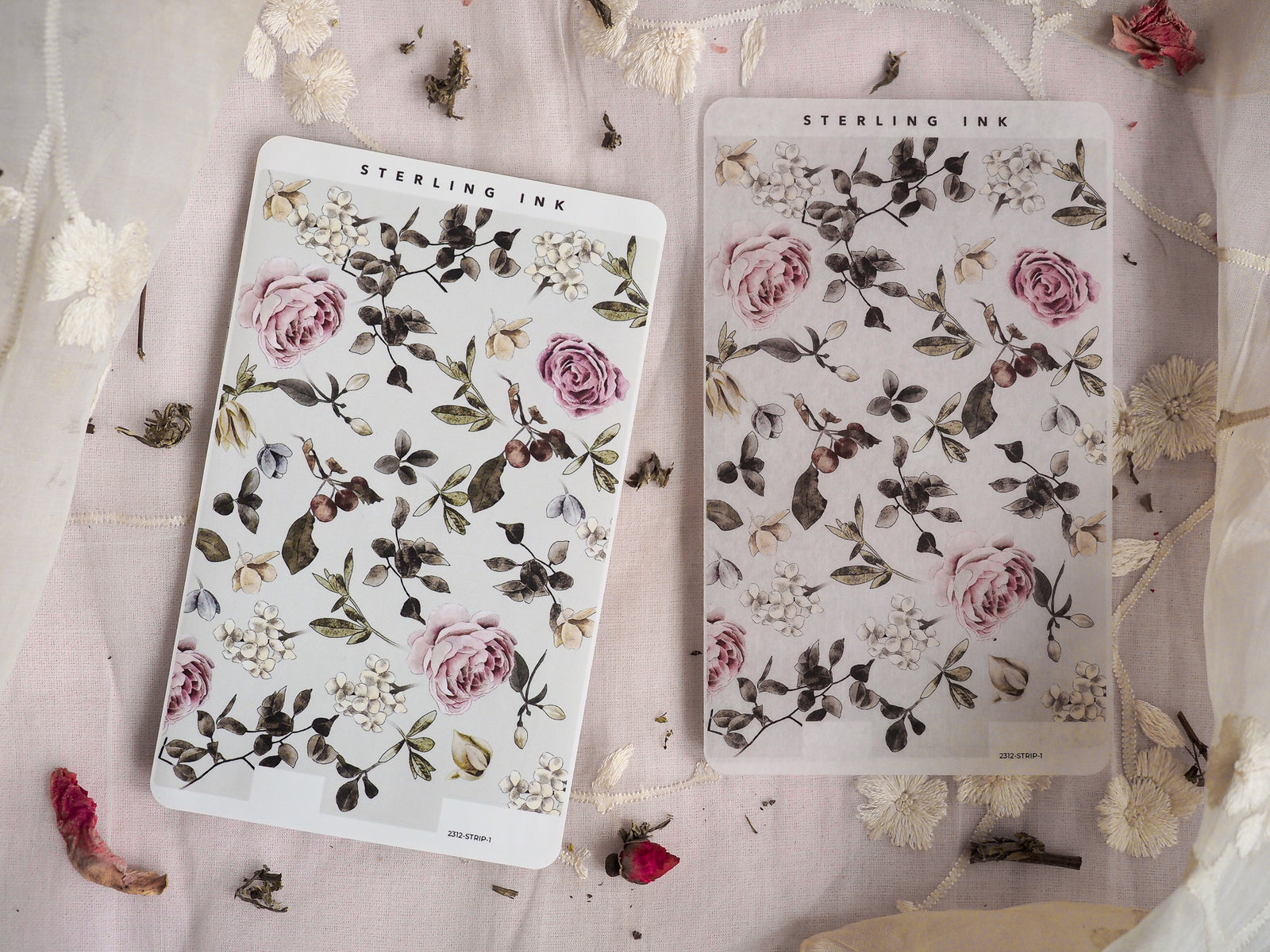Botanical strip stickers featuring a lush, moody arrangement of dusty pink roses, varied green foliage, and small white filler flowers.