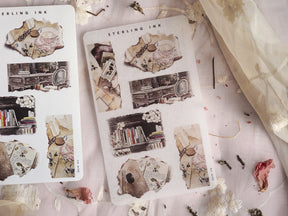 A set of sepia-toned, torn paper stickers featuring vintage ephemera, stacked books, and decorative aged journaling accents for scrapbooking.