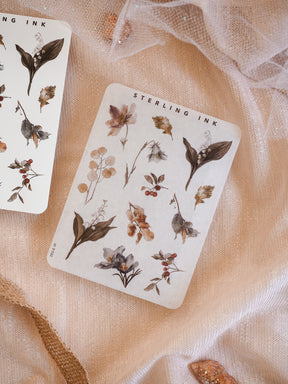 Rustic sticker set featuring dried botanical elements, autumnal leaves, delicate florals, and berries, perfect for journaling and craft projects.