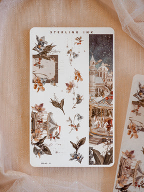 A festive winter Washi sticker strip featuring detailed silver foil accents, seasonal botanical leaves, berries, and a cozy, snowy European Christmas market scene.