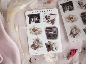 Large icon sticker set with silver foil accents, featuring vintage monochrome designs like stacks of books, framed photos, letters, and decorative ephemera.