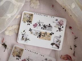 Assortment of antique-style stickers with silver foil edges, delicate floral illustrations, and printed postage stamps for vintage scrapbooking and journaling.