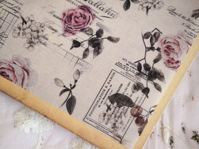 Vintage beige planner page featuring delicate engravings of pink roses, grapes, and berries with classic French typography and a romantic, rustic flair.