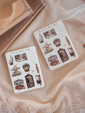 Vintage icon sticker sheets featuring detailed, black and white illustrations of miniature elements, including shop fronts, gas lamps, and seasonal vignettes.