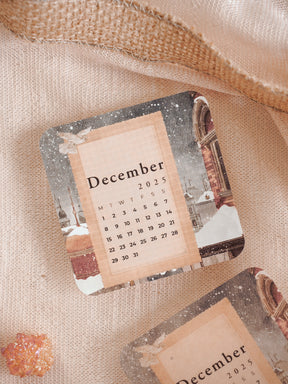 Distressed printable sticker calendar for December 2025, framed with vintage sepia-toned architecture and aged edges for seasonal planning.