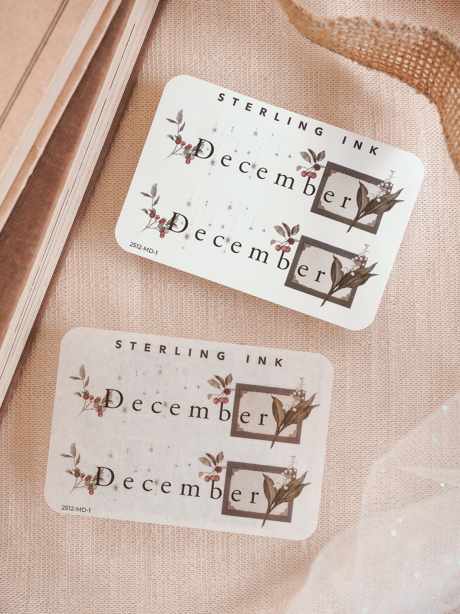 Decorative December monthly stickers featuring rustic, botanical prints of foliage and berries for themed planning and journaling.