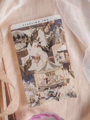 Vintage decorative sheet for December 2025, showcasing a whimsical carousel surrounded by rich botanical drawings and ornate, muted-toned architecture.