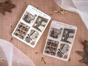 Detailed sheet of festive illustration stickers featuring December scenes, including vintage architecture and seasonal motifs, suitable for journaling and crafting.