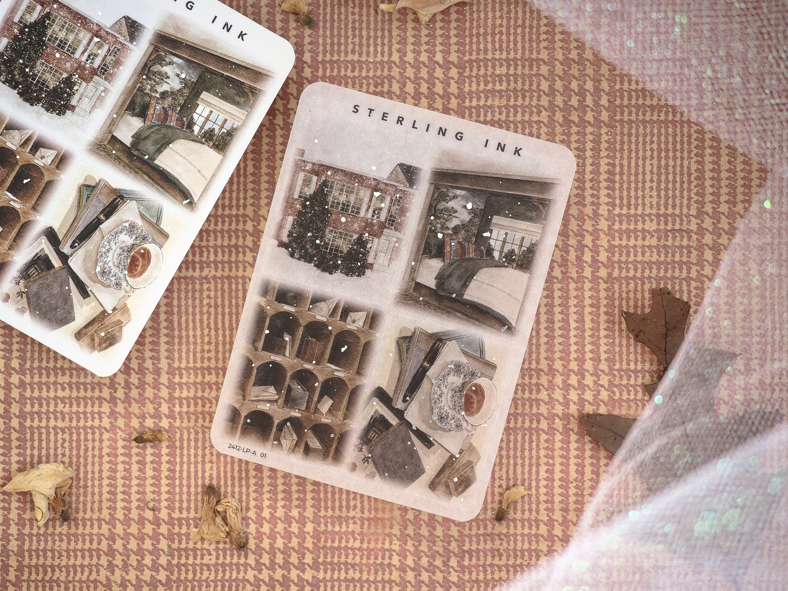 Festive sticker sheets displaying vintage, snowy December illustrations of brick buildings, evergreen wreaths, and cozy winter-themed decorative motifs.