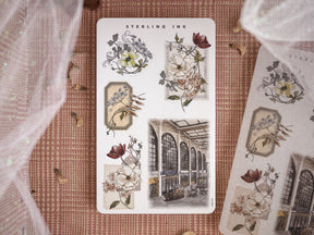 Vintage botanical sticker sheet displaying detailed floral bouquets, elegant wreaths, and an antique marketplace scene perfect for seasonal crafting.