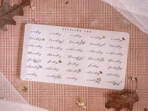 White sticker set with delicate cursive typography for weekly planning labels, featuring organized text for a December 2024 calendar layout.