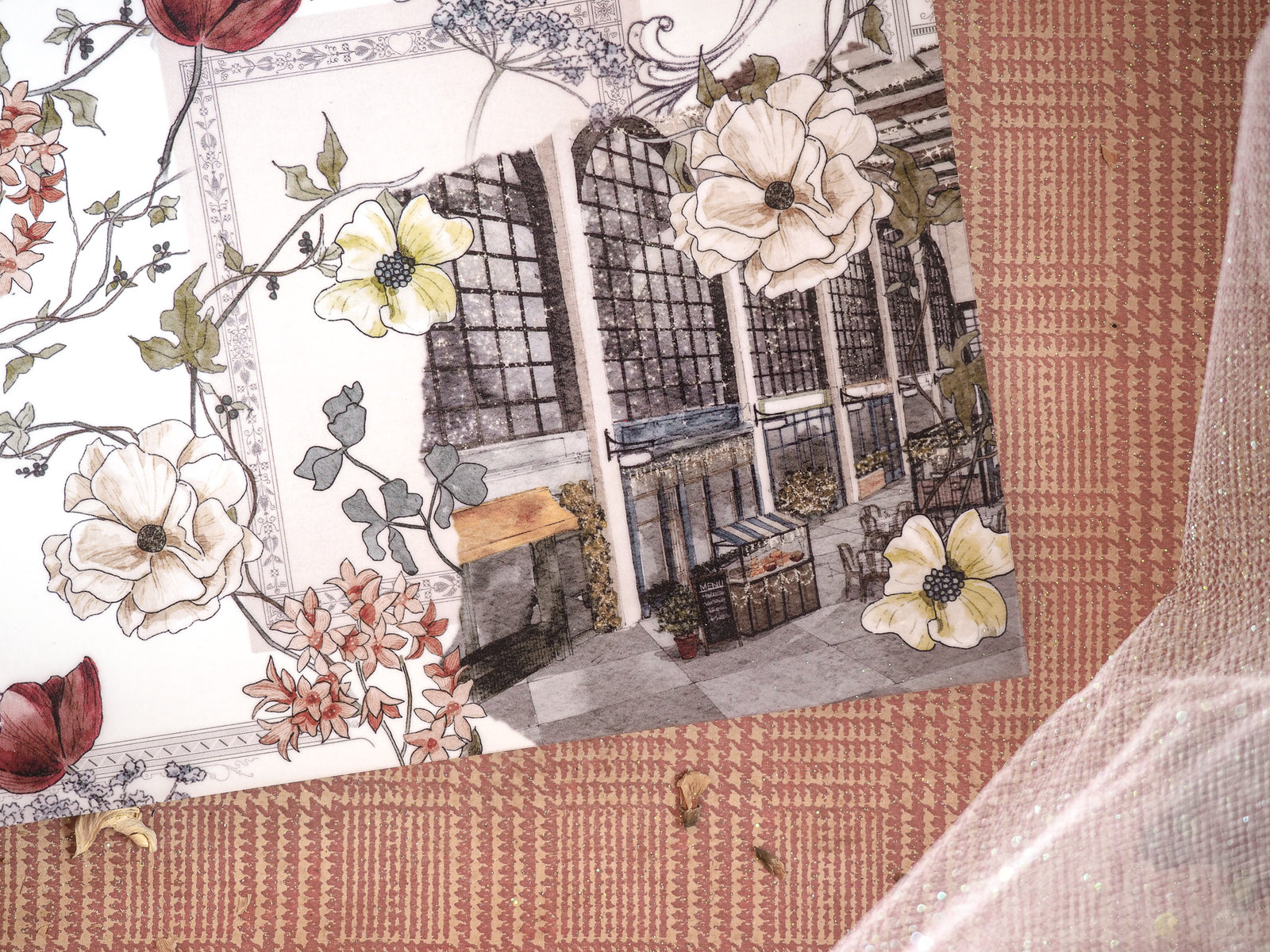 December-themed design featuring an artistic blend of lush, cream and yellow florals with a detailed illustration of a dark, multi-paned architectural storefront.