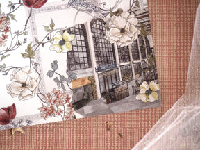 December-themed design featuring an artistic blend of lush, cream and yellow florals with a detailed illustration of a dark, multi-paned architectural storefront.