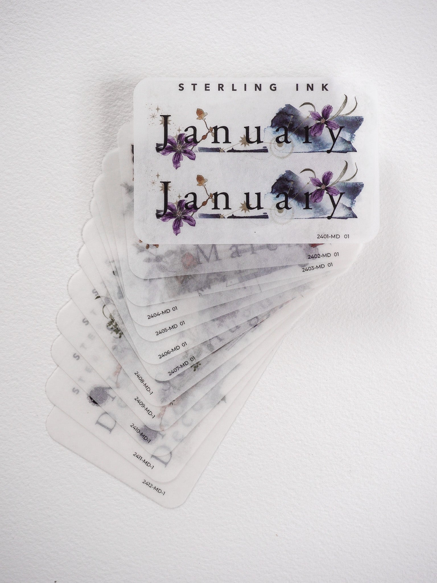 Watercolor floral stickers for monthly journaling, showcasing delicate purple blossoms and greenery for planner decoration.