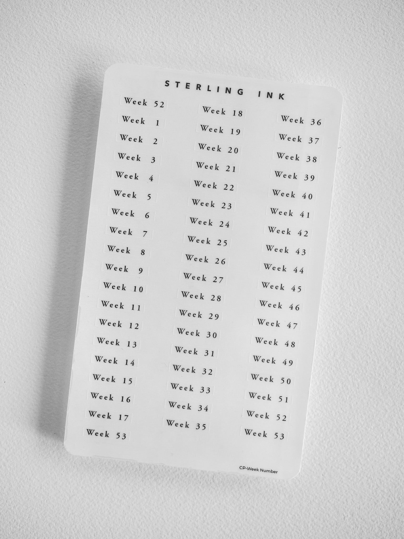 White label sheet containing black text labels for every week, sequentially numbered from Week 1 to Week 53 for annual planning or academic organization.