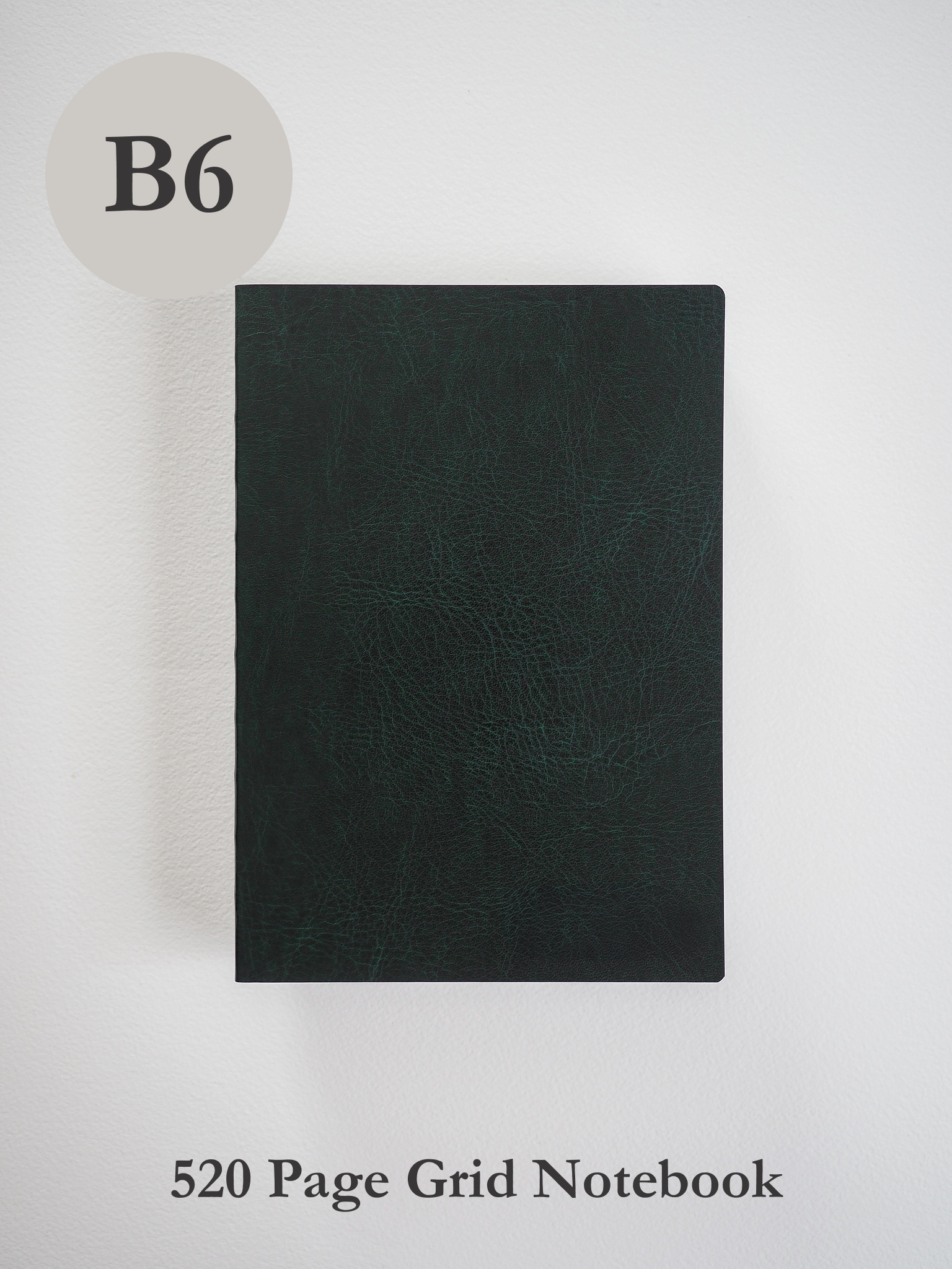 Solid black B6 notebook featuring a smooth, textured cover, designed for professional writing, sketching, and structured grid note-taking.